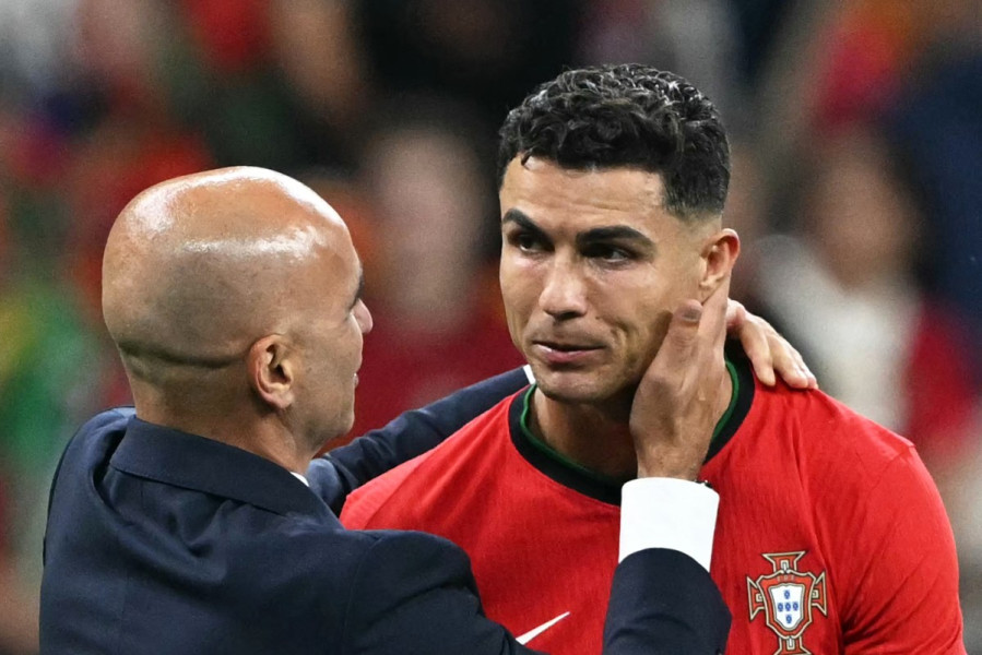الإسباني روبرتو مارتينيس مدرب المنتخب البرتغالي وكريستيانو رونالدو